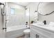 Bathroom featuring white marble tile and modern black fixtures at 2260 S Lewiston St, Aurora, CO 80013