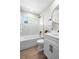 Well-lit bathroom with white marble tile and modern black fixtures at 2260 S Lewiston St, Aurora, CO 80013