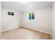 Bright bedroom offers light wood-look floors and windows at 2260 S Lewiston St, Aurora, CO 80013