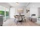 Charming dining area featuring modern furnishings, with views of the serene outdoor greenery at 2260 S Lewiston St, Aurora, CO 80013