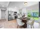 Bright dining area adjacent to the kitchen, featuring stylish furnishings and natural light at 2260 S Lewiston St, Aurora, CO 80013