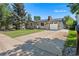 A beautiful house with a stone facade, a well-maintained lawn and an attached garage at 2260 S Lewiston St, Aurora, CO 80013
