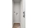 Compact laundry area featuring sleek white walls and minimalist design at 2260 S Lewiston St, Aurora, CO 80013