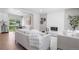 Bright living room with a cozy white brick fireplace and stylish, neutral-toned furniture at 2260 S Lewiston St, Aurora, CO 80013