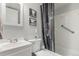 Cozy bathroom with a bathtub, shower, and modern vanity with great lighting at 11147 W 17Th Ave # 103, Lakewood, CO 80215