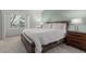 Bright bedroom features natural light from the large window and cozy furnishings with a king size bed at 11147 W 17Th Ave # 103, Lakewood, CO 80215