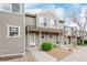Inviting townhome with landscaped front yard and a welcoming entrance at 11147 W 17Th Ave # 103, Lakewood, CO 80215