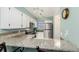 Modern kitchen featuring granite countertops, stainless steel appliances, and white cabinets at 11147 W 17Th Ave # 103, Lakewood, CO 80215