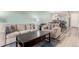 Inviting living room with a comfortable sofa, chair, decorative pillows, and modern furnishings at 11147 W 17Th Ave # 103, Lakewood, CO 80215