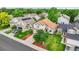 Stunning aerial view of a well-manicured property with mature trees and a pristine lawn at 11355 Haswell Dr, Parker, CO 80134