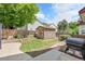 Picturesque backyard featuring a storage shed, manicured lawn, and stone pathway for outdoor activities at 11355 Haswell Dr, Parker, CO 80134