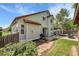 Charming backyard featuring a paved patio, lush greenery, and privacy fence, ideal for outdoor entertaining at 11355 Haswell Dr, Parker, CO 80134