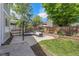 Spacious backyard with a concrete patio, verdant lawn, and mature trees providing shade and privacy at 11355 Haswell Dr, Parker, CO 80134