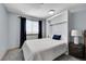 Cozy bedroom featuring a Murphy bed, gray carpet, and natural light from the window at 11355 Haswell Dr, Parker, CO 80134