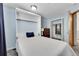 Murphy bed setup with a closet, side table with lamp and light blue walls at 11355 Haswell Dr, Parker, CO 80134