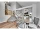 Spacious dining area with vaulted ceilings, hardwood floors, and abundant natural light at 11355 Haswell Dr, Parker, CO 80134