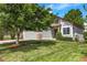 Charming home showcasing a lush green lawn, mature trees, and a well-manicured front yard at 11355 Haswell Dr, Parker, CO 80134