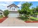 Charming two-story home with lush lawn, mature trees, and a two-car garage at 11355 Haswell Dr, Parker, CO 80134