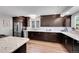 This bright kitchen offers modern cabinetry, granite countertops, stainless appliances and sleek wood flooring at 11355 Haswell Dr, Parker, CO 80134