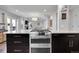 This kitchen features a breakfast bar and is open to the living and dining areas at 11355 Haswell Dr, Parker, CO 80134