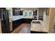 Spacious kitchen features granite countertops, stainless steel appliances, and dark wood cabinetry at 11355 Haswell Dr, Parker, CO 80134