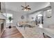 Spacious living room with a fireplace, and dining area with lots of natural light at 11355 Haswell Dr, Parker, CO 80134