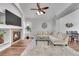Open living and dining space with a fireplace, hardwood floors, and modern decor at 11355 Haswell Dr, Parker, CO 80134