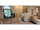 Inviting living room adjacent to dining area, features plush seating and staircase access at 11355 Haswell Dr, Parker, CO 80134