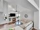 Open-concept living area with cozy fireplace, vaulted ceiling, and plenty of natural light at 11355 Haswell Dr, Parker, CO 80134