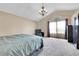 Vaulted main bedroom featuring plush carpet, large window and a cozy chair at 11355 Haswell Dr, Parker, CO 80134
