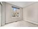 Simple bedroom with carpeted floor and a window at 2438 Welton St, Denver, CO 80205