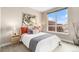 Spacious bedroom with large window, offering city views at 2438 Welton St, Denver, CO 80205