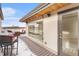 Rooftop deck with snow, seating, and access to interior at 2438 Welton St, Denver, CO 80205