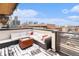 Private rooftop deck with seating area and city views at 2438 Welton St, Denver, CO 80205