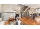 Bright living room featuring hardwood floors, staircase, and modern furniture at 2438 Welton St, Denver, CO 80205