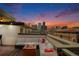 Spacious rooftop deck with city views and fire pit at 2438 Welton St, Denver, CO 80205