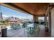 Rooftop patio with tables and chairs, offering city views at 2438 Welton St, Denver, CO 80205