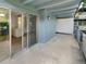 Balcony with sliding glass doors to living area, patio, and storage at 2401 S Gaylord St # 206, Denver, CO 80210