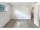 Bedroom features a closet and large window with neutral colors at 2401 S Gaylord St # 206, Denver, CO 80210