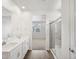 A main bathroom features a dual vanity and glass walk-in shower at 1975 S Coolidge Way, Aurora, CO 80018