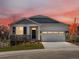Charming single-Gathering home with a well-manicured lawn, two-car garage, and stone detailing at 1975 S Coolidge Way, Aurora, CO 80018