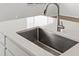 Close-up of kitchen sink with faucet and white countertop at 1975 S Coolidge Way, Aurora, CO 80018