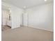 A spacious main bedroom with carpeted floors features the main bathroom at 1975 S Coolidge Way, Aurora, CO 80018
