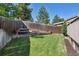 Large yard with multi-layered wooden planters and wooden fence at 3838 S Waco St, Aurora, CO 80013