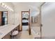 Ensuite bathroom featuring double sinks and a separate tub and shower at 3838 S Waco St, Aurora, CO 80013