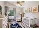 Comfortable Bedroom with large window, comfy chair and lovely art at 3838 S Waco St, Aurora, CO 80013