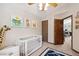 Bright and cheery Bedroom room with crib and natural light at 3838 S Waco St, Aurora, CO 80013