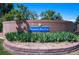 Attractive brick sign for Hampden Run Park with lush landscaping and trees at 3838 S Waco St, Aurora, CO 80013