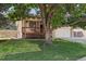 Charming home featuring a well-manicured lawn, mature shade tree, and inviting front porch at 3838 S Waco St, Aurora, CO 80013