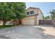 Charming two-story home featuring a well-manicured lawn, large tree, and a spacious driveway at 3838 S Waco St, Aurora, CO 80013